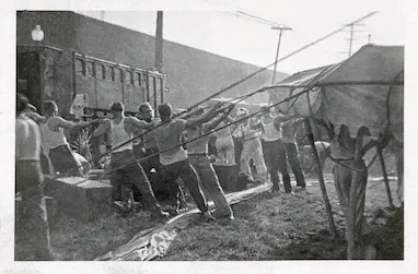 Circus workers raising the big top, photographed by Bill Peet